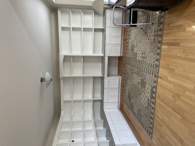 Completed custom built-in library and cabinetry by Square One Construction
